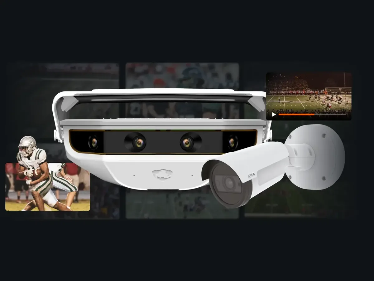 A football player runs with the ball on a football field, captured by Hudl's automated Focus camera system.