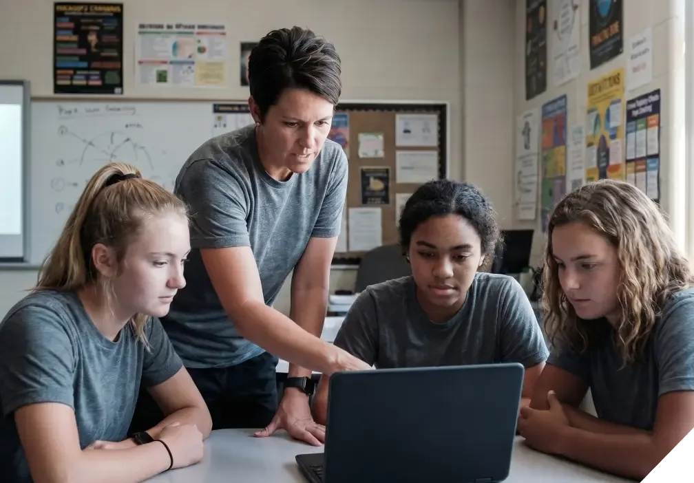 A goups of analysts meeting with an expert from Hudl