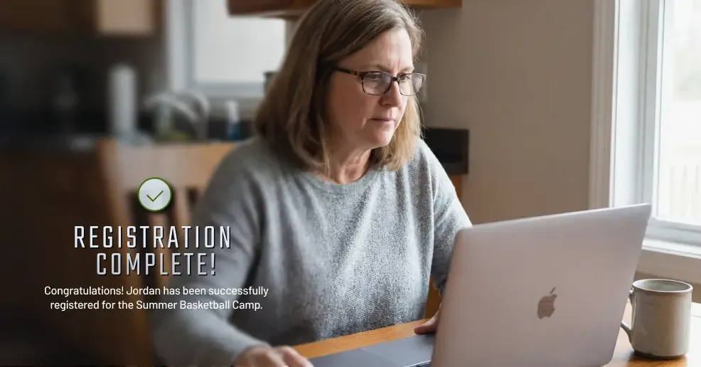 Photoillustration depicting a parent completing a registration for their child. the image overlay reads 'Registration Complete! Jordan has been successfully registered for Summer Basketball Camp.'